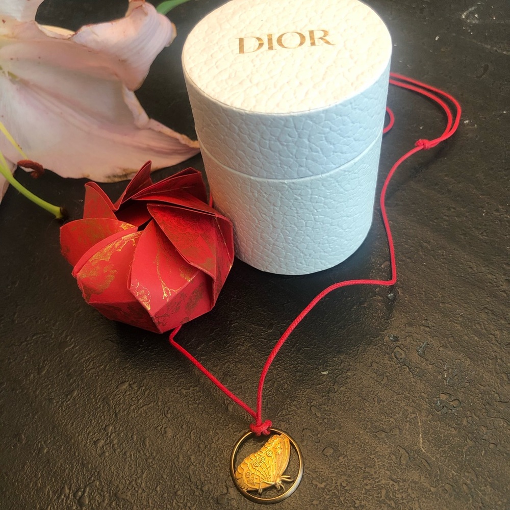 Dior NWOT Gold Butterfly Pendant on Red Cord